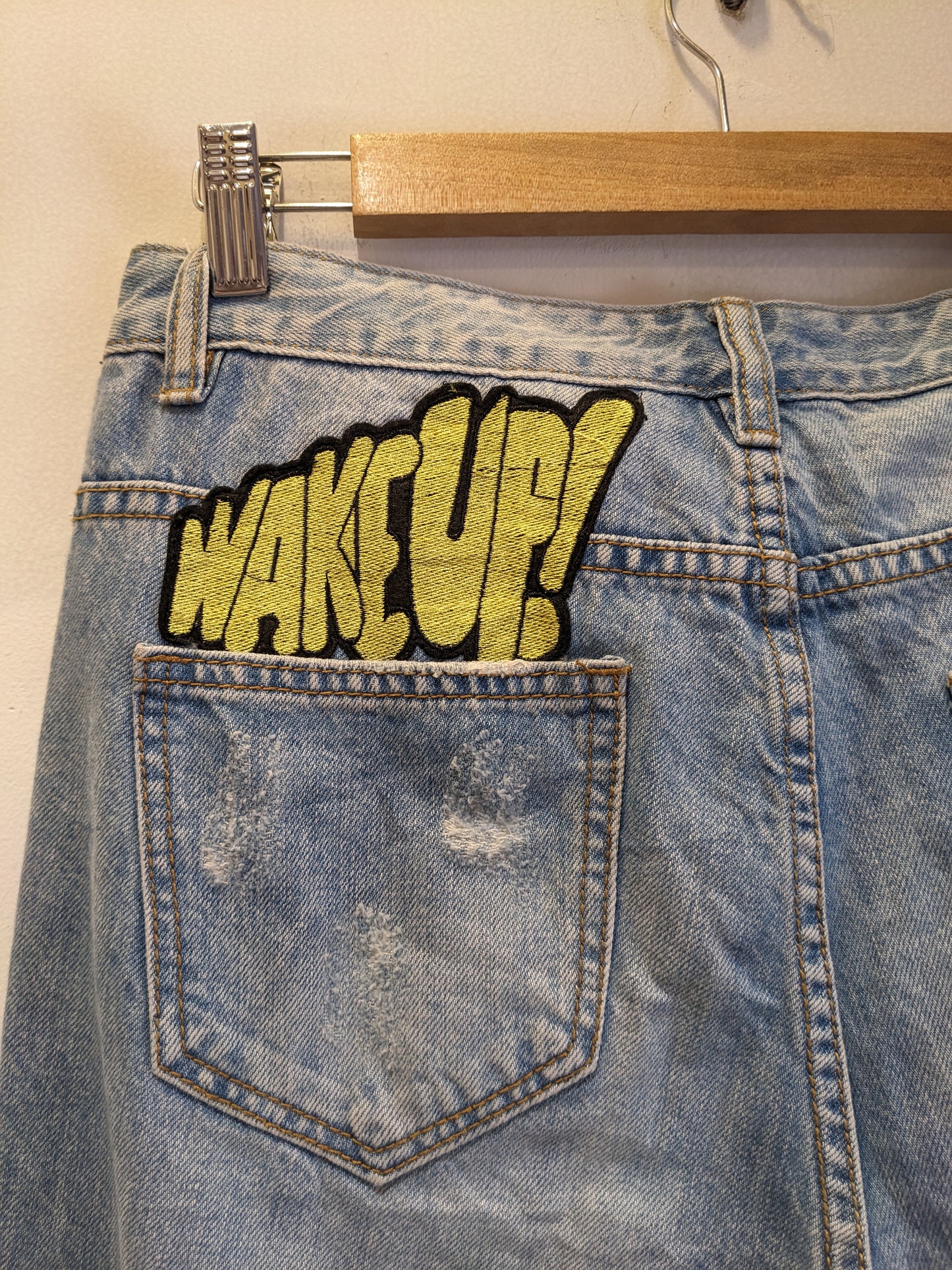 Light Blue Ripped Jeans With Funky Backpocket Patches