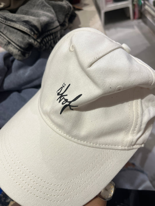White cap with black details