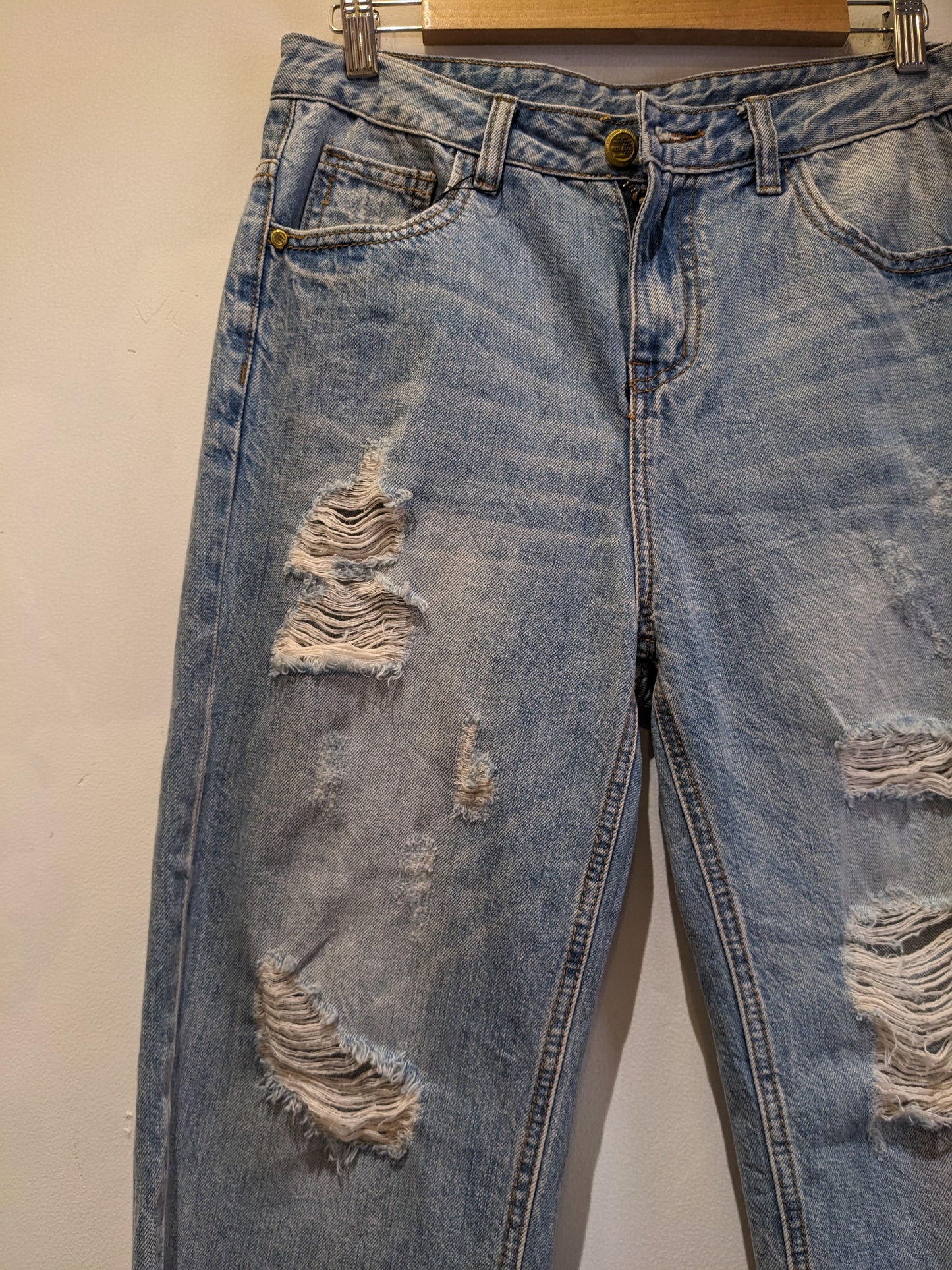 Light Blue Ripped Jeans With Funky Backpocket Patches